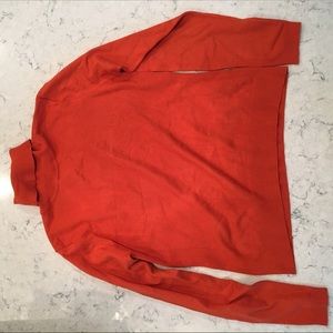 Xandres orange turtleneck sweater